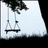 Pixelated grayscale image of a swing set with two swings under a tree, against a light background.