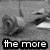 Black-and-white animated image of a person's face with text overlays reading "the more ujudge" and "the less u love" across two