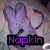 Pixelated purple bunny with large ears and a curved tail, standing against a blurred multicolored background with the word 'Napkin' in bright purple text on black.