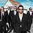 A pixelated contact sheet showing two frames of an animated icon featuring a group of men in black suits on the left and text reading "OMG They're BACK again" on a yellow-to-orange gradient background on the right.