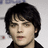 Pixelated image of a person with dark hair on a bright pink background with blue text reading "Hey, wait... I know you. Or, I'd like to......Gerard Way We luv u".