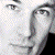 nine pixelated face images arranged around a central black with red text reading "He's BAD! He's COOL! He's... James Marsters"