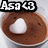 A cup of brown liquid with a white heart-shaped foam design, labeled 'Asa <3' in black and white text above.