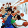 A pixelated image shows multiple figures in blue, green, and white shirts holding basketballs, with orange motion lines radiating from the center.