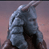 Static pixelated icon of a blue armored figure with helmet and shoulder pads against a gradient background.
