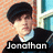 Pixelated portrait of a person with dark hair wearing a black jacket over light blue shirt, standing against orange and teal background with text "Jonahon" at bottom.