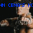 Pixelated image of a person in dark clothing with a raised arm, blue text reading "N CENA'S M" visible at the top.