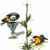 Animated sequence of a blue bird with orange beak and feet perched on green stems, alternating between upright posture and leaning left.