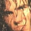 nine identical animated frames showing a person with curly hair and warm lighting, each displaying the text 'BROODING.' in white lowercase letters at the bottom