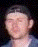 A person's face transitions through multiple skull overlays with varying jaw positions and eye visibility, ending as a blurred human face.