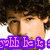 Pixelated close-up of a person with dark curly hair and light skin, featuring purple text overlay at the bottom.