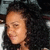 A person with curly dark hair in a of four showing slight head position changes