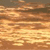 A static pixelated image with horizontal bands of brown, orange, and yellow hues, showing no distinct subjects or text.