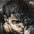 A pixelated image of a person with dark hair and light skin, wearing a dark jacket over a light shirt.