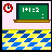 Animated pixel art of a classroom scene with green chalkboard, pink background, and blue-yellow checkered floor showing text animation from 'SCHOOL' to 'SCHOOL!'