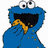 Blue cookie monster character with large white eyes and black pupils, covering mouth with hand while holding a yellow cookie, scattered cookie crumbs on body, white background.