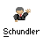 Pixelated character with gray hair, black jacket, red-and-white checkered tie, and raised right hand, above stylized text reading 'Schundler' on gray background.
