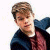 A pixelated image of a person with light brown hair wearing a dark jacket over a maroon shirt, positioned next to green text reading "Original Icons .com" on a solid background.