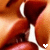 repeated close-up images showing lips in a kissing pose with visible teeth and red lipstick, each containing a small white heart symbol