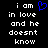 Black background with white pixelated text reading 'i am in love and he doesnt know' and a blue pixelated heart symbol above the text.