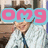 A person in a light blue striped shirt and dark tie sits in front of a window with framed pictures, with animated text overlays changing from 'omg' to '<333' in pink and light blue.