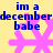 Yellow background with blue text reading "im a december babe" above pink snowflake shapes, two variations of the same design displayed side-by-side.