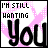 Two side-by-side pixelated text images with 'I'M STILL WANTING' above large lowercase letters, one black on white background and the other pink on white.