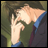 Pixelated anime-style character with dark hair and green clothing making a hand gesture, next to black background with white text.