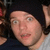 A contact sheet of two animated frames showing a person in a black beanie and gray shirt with slight facial expression changes between frames.