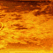Animated sequence showing hands reaching toward a fiery, ornate golden structure with circular elements and red fabric background.