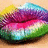 Pixelated lips with rainbow gradient colors on a light brown background, accompanied by cyan text reading 'Kiss' and 'this'.