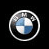 A pixelated animated contact sheet showing two frames of a BMW logo on the left and golden text reading 'Rocks' on the right against a black background.
