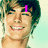 A four- shows a person with light brown hair and a light blue background, with changing pink text overlays