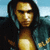 Pixelated static image of a person with long dark hair wearing a dark jacket over a light-colored shirt against a blue sky background.