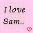 Pixelated text reads "I love Sam." on a pink and gray checkered background with a red heart symbol.