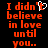 Red pixelated text on black background reads "I didn't believe in love until you.." with a white heart symbol replacing the apostrophe in 'didn't'.