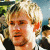 A four- shows a person with light hair in sequential text overlays: 'D', 'Do', and 'Dom' appearing below the head