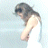 Pixelated static icon of a person with dark hair in profile view, head bowed downward, wearing light-colored clothing against a pale blue background.