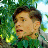 Pixelated static image of a person's face with green foliage background, likely from an AOL Instant Messenger buddy icon.