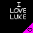 Black background with white text "I LOVE LUKE" and a pink triangular shape containing a heart symbol, animated to shift position.