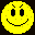 Four pixelated yellow smiley faces arranged in a 2x2 grid, each with distinct facial expressions and features against a black background.