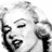 Black-and-white pixelated image of Marilyn Monroe with text 'Oh so Oh so Marilyn!' in mixed fonts, showing multiple poses including a close-up and full-body view.