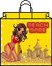 Yellow shopping bag with black handle, red bikini-clad woman kneeling on sand, sandcastles with red flags, 'BEACH BABE' text in red block letters.