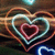 Pixelated heart-shaped icon with layered outlines in brown, light blue, and pink against a dark background.