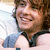 six colored squares with text and a partial photo of a person with curly hair and a gray shirt