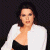 A pixelated image of a person in a white jacket over black clothing against dark background, with green text reading 'Original Icons .com' on the right.