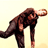 Pixelated static image of a person in dark clothing performing a dynamic pose against a light background.