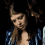 A four- shows a person with long brown hair in a blue patterned top, with visible text 'amber' in the bottom-right