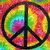 A circular peace symbol with black outline and internal lines, set against a vibrant tie-dye background of red, green, yellow, and blue hues.
