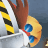 A pixelated image shows a brown hand holding a yellow and black striped object against a blue-gray background.